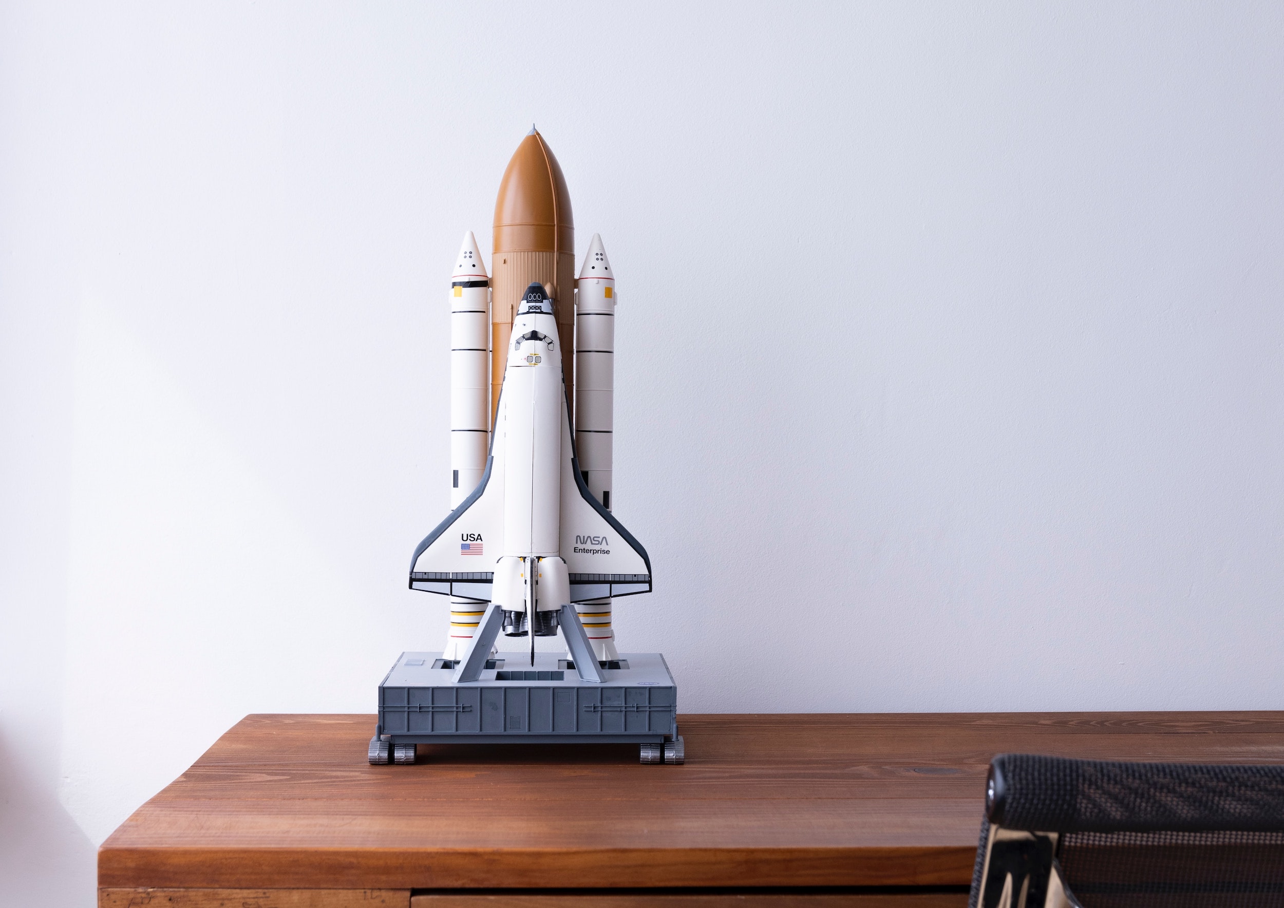 model rocket sitting on a writing desk