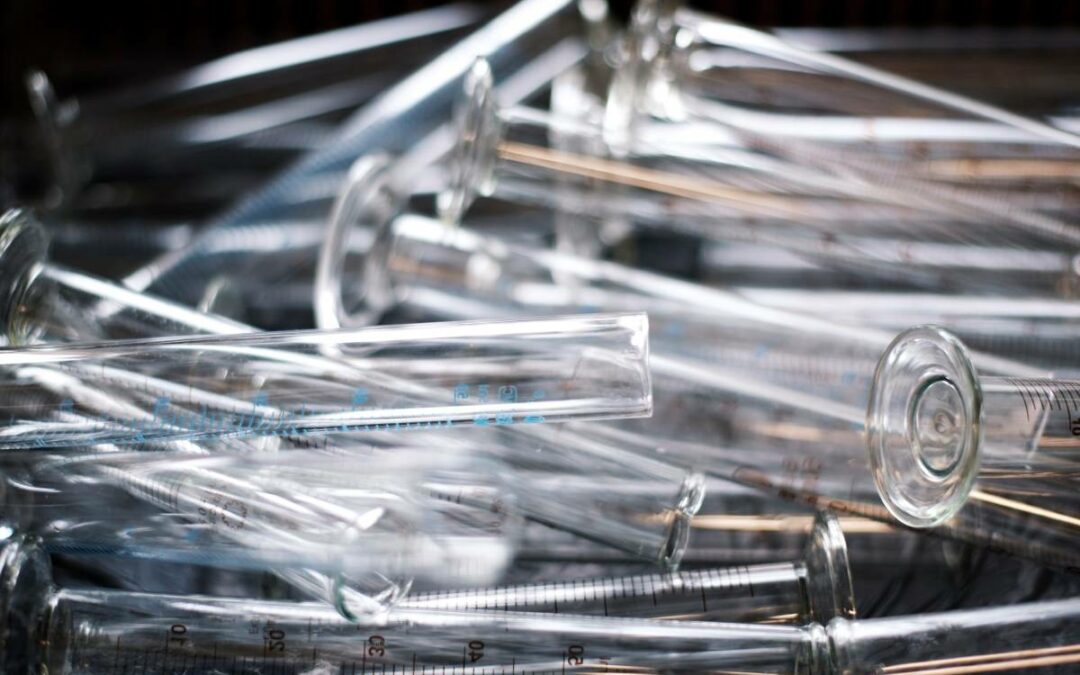 A stack of empty graduated cylinders potentially used for genetic testing