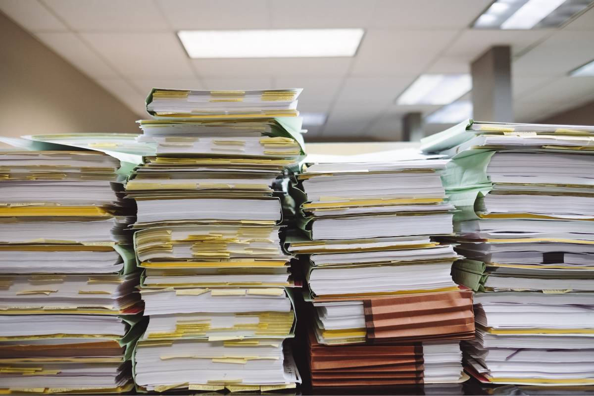 piles of regulatory paperwork FDA 510 k stacks of papers