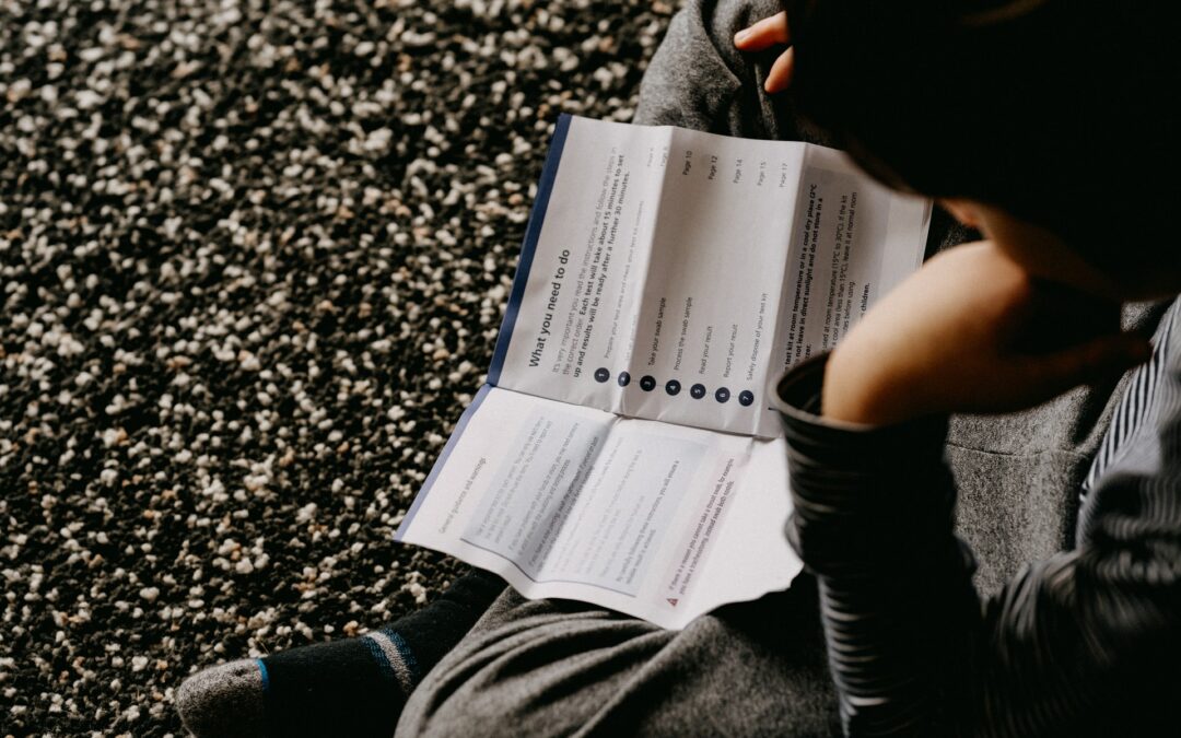 person reading packet at-home testing covid user comprehension study